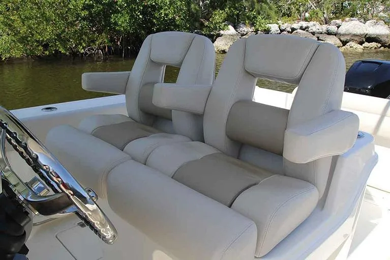 Slide: The Image of Seating area of 2026 Boston Whaler 280 Outrage with beige upholstery. - 9