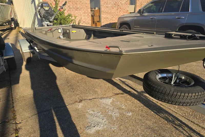 The Image of 2026 Go-Devil 18x60 Surface Drive Boat on trailer, parked outdoors. - 0