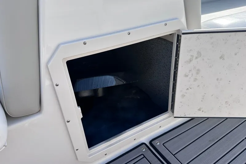 Slide: The Image of Open storage compartment on 2023 Starcraft SVX 191 OB boat, featuring sleek design and durable materials. - 10