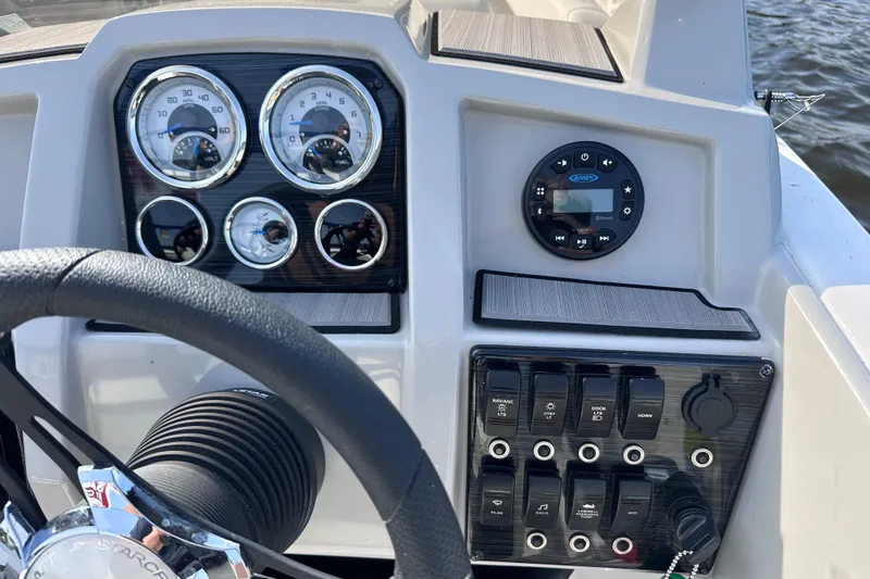 Slide: The Image of Dashboard of 2023 Starcraft SVX 191 OB boat with gauges and controls. - 13