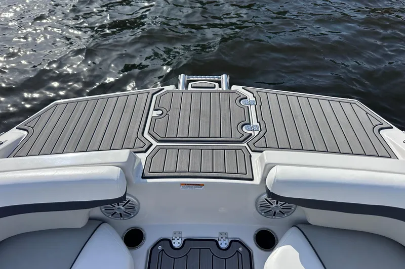 Slide: The Image of 2023 Starcraft SVX 191 OB boat deck with sleek gray flooring on water. - 20