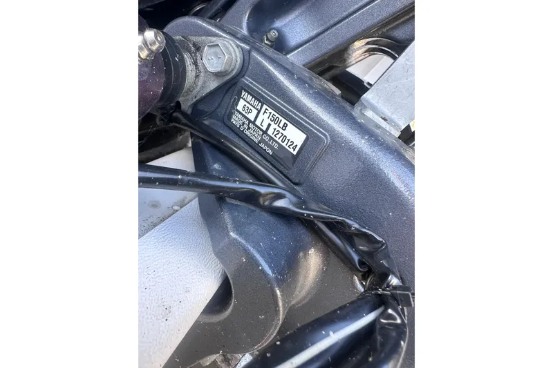 Slide: The Image of Close-up of Yamaha engine part on 2023 Starcraft SVX 191 OB boat. - 31