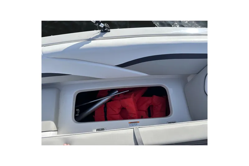 Slide: The Image of Storage compartment in 2023 Starcraft SVX 191 OB boat with life jackets. - 7
