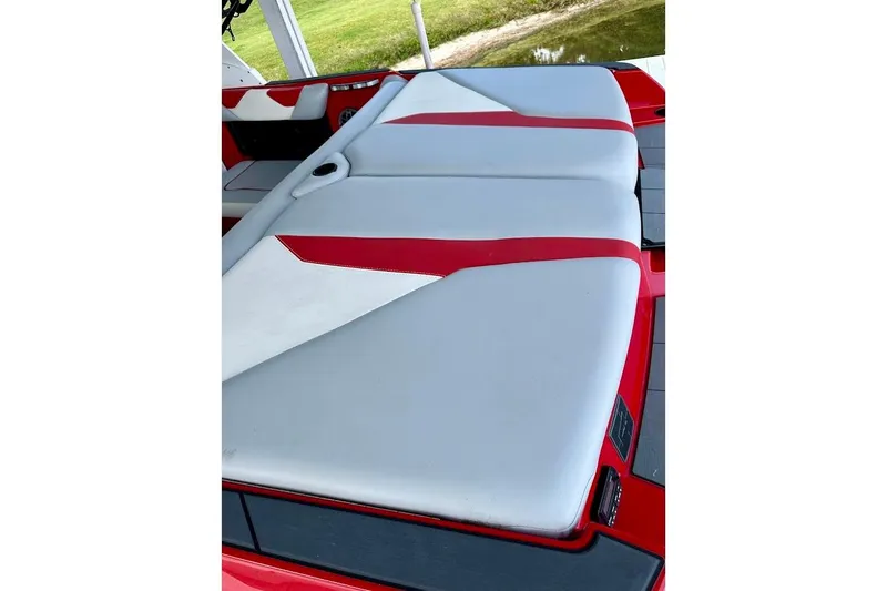Slide: The Image of 2021 Axis A20 boat interior with red and white cushioned seating. - 11