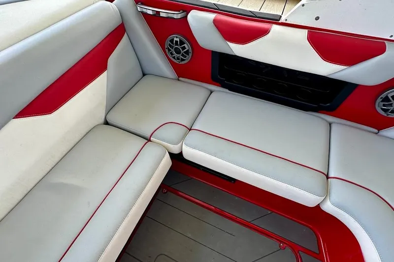 Slide: The Image of 2021 Axis A20 boat interior with red and white cushioned seating. - 31