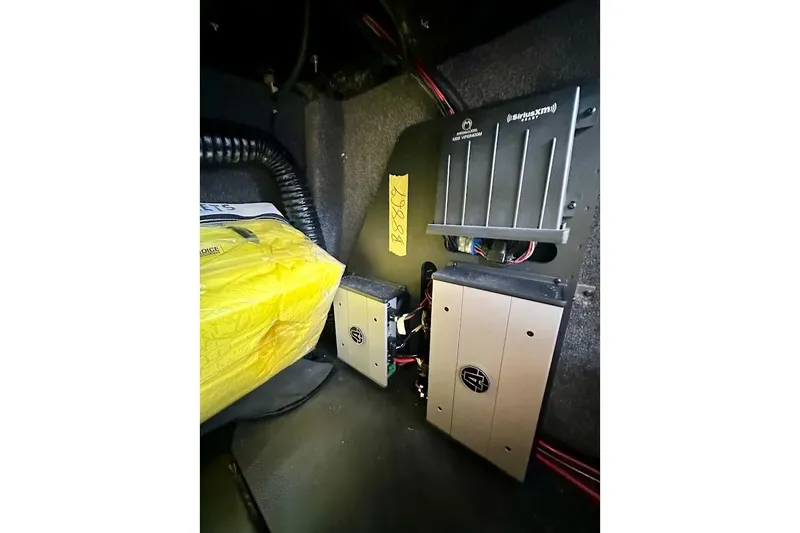 Slide: The Image of 2021 Axis A20 interior showing audio equipment and wiring setup. - 33