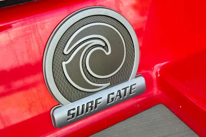 Slide: The Image of Surf Gate emblem on red 2021 Axis A20 boat. - 4