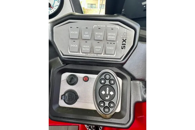 Slide: The Image of Control panel of a 2021 Axis A20 boat with various function buttons. - 40