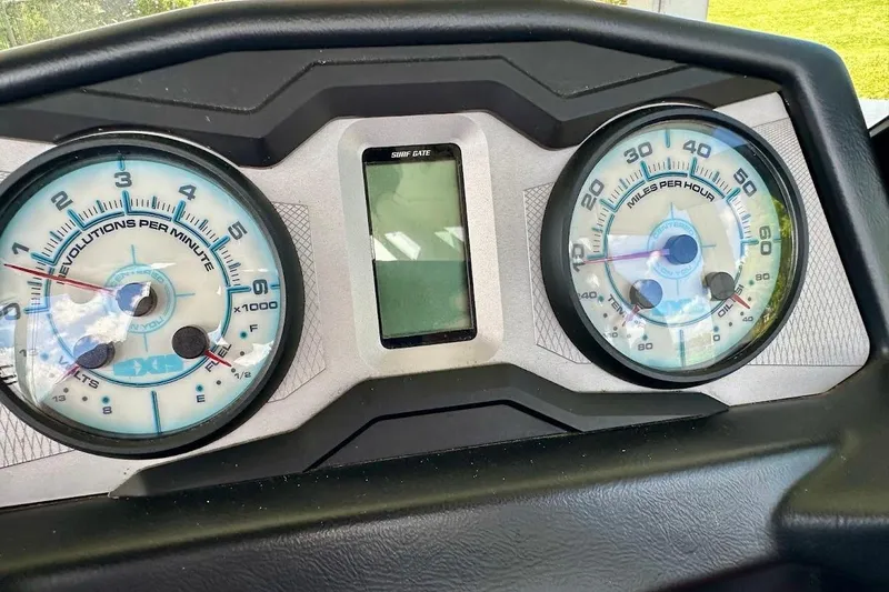 Slide: The Image of Dashboard of a 2021 Axis A20 boat showing RPM and speed gauges. - 41