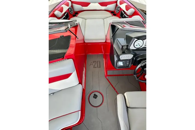 Slide: The Image of 2021 Axis A20 boat interior with red and gray seating and dashboard. - 45