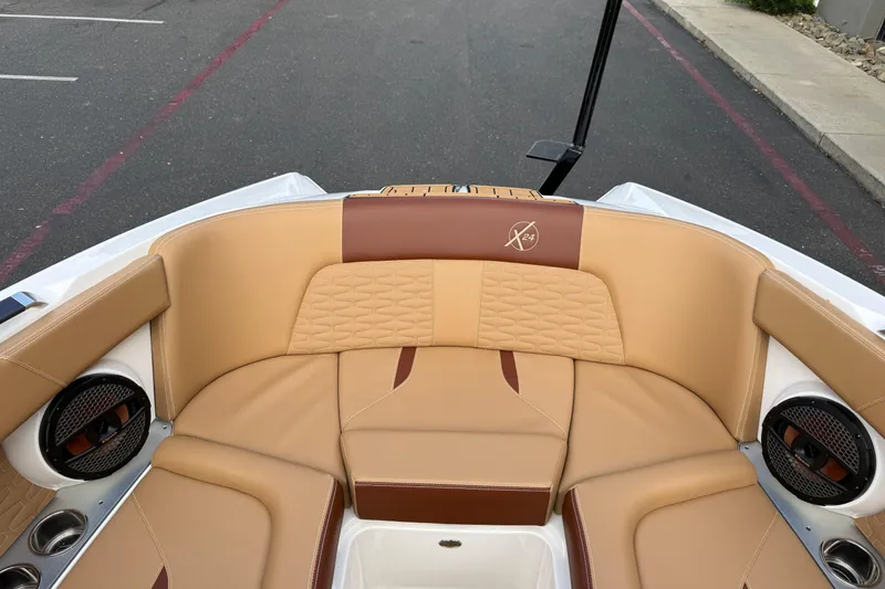 Slide: The Image of Luxurious interior of 2025 MasterCraft X24 boat with tan and brown seating. - 43