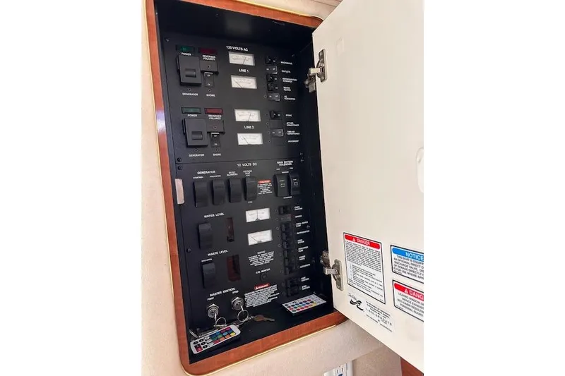 Slide: The Image of Electrical control panel inside a 2002 Sea Ray 340 Sundancer boat. - 31