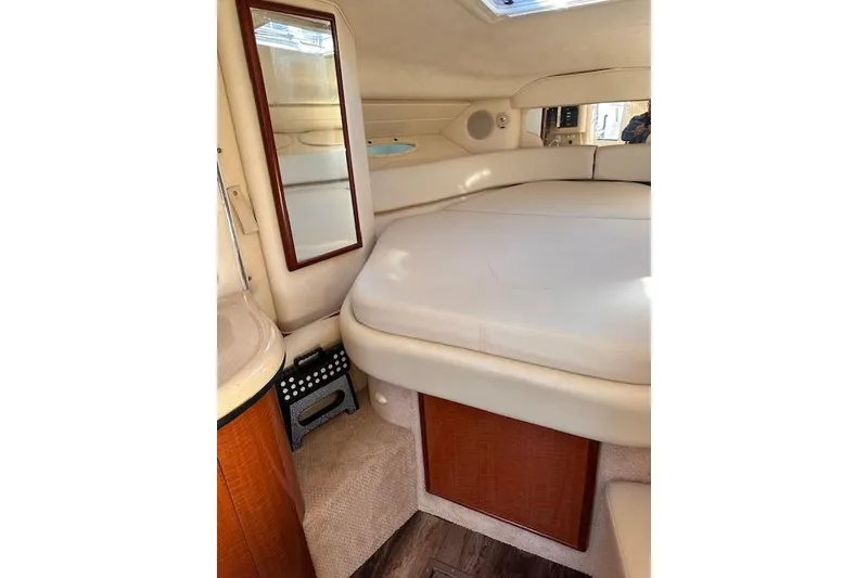 Slide: The Image of Interior cabin of 2002 Sea Ray 340 Sundancer with bed and mirror. - 37