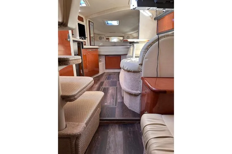 Slide: The Image of Interior of 2002 Sea Ray 340 Sundancer yacht with elegant wood and leather finishes. - 49