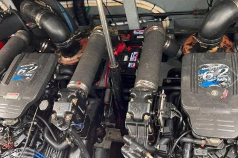 Slide: The Image of Engine compartment of a 2002 Sea Ray 340 Sundancer boat, featuring dual 6.2 MPI engines. - 63