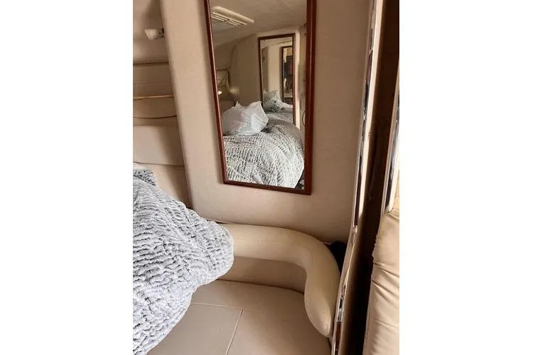 Slide: The Image of Interior of 2002 Sea Ray 340 Sundancer with mirror and cozy seating area. - 74