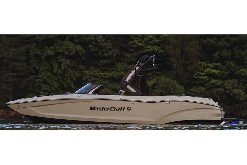 The Image of Manufacturer Provided Image: 2024 MasterCraft X24 boat on a lake with forest background. - 1
