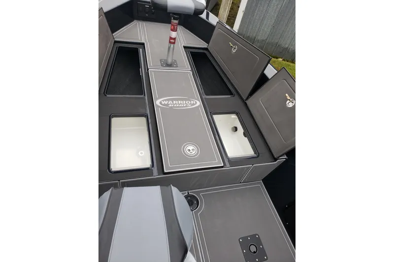 Slide: The Image of 2026 Warrior V2090 boat interior with storage compartments and seating. - 6