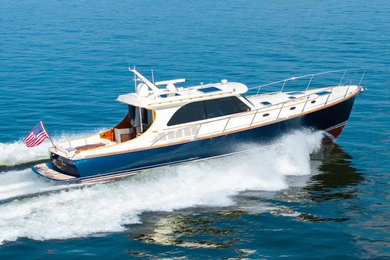 The Image of 2012 Hinckley Talaria 48 Motoryacht cruising on water. - 1