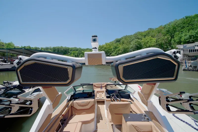 Slide: The Image of 2025 MasterCraft XStar 25 boat interior with advanced sound system on a sunny day. - 18