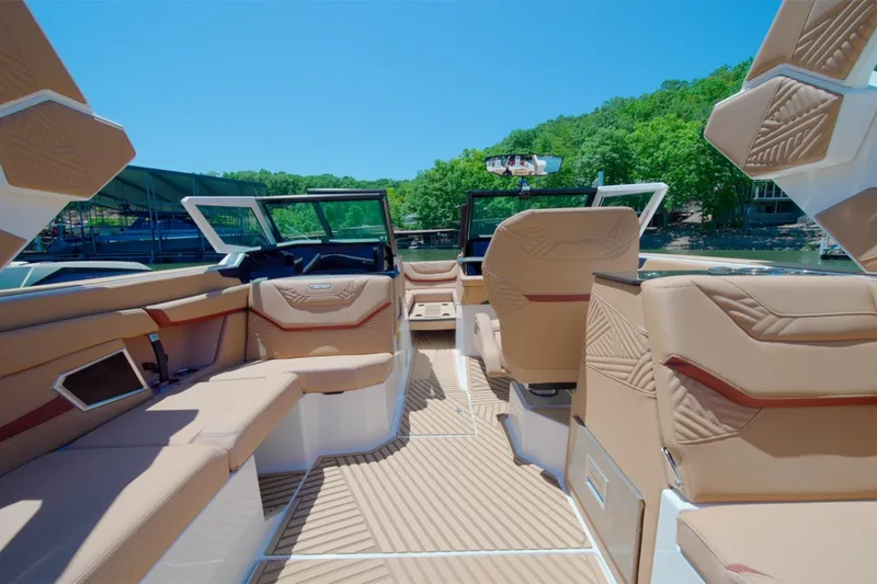 Slide: The Image of Interior of 2025 MasterCraft XStar 25 boat with luxurious seating and modern design. - 20