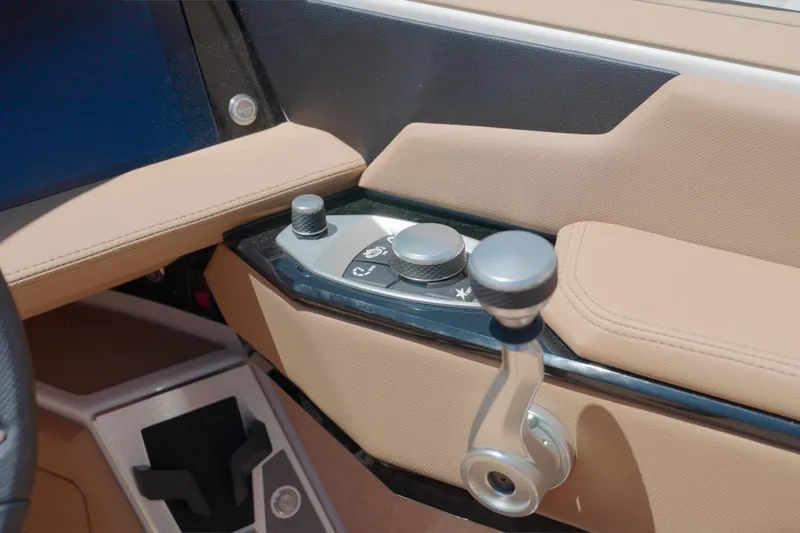 Slide: The Image of Interior controls of 2025 MasterCraft XStar 25 boat, featuring sleek design and modern technology. - 24