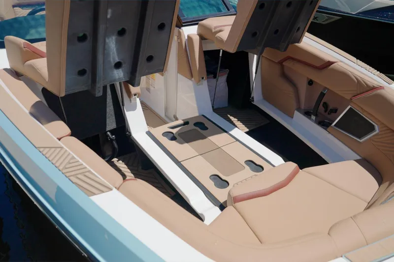 Slide: The Image of 2025 MasterCraft XStar 25 boat interior with tan seating and modern design. - 25