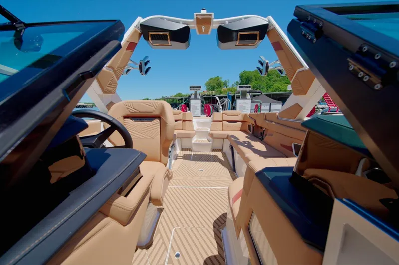 Slide: The Image of Interior of 2025 MasterCraft XStar 25 boat with luxurious seating and modern design. - 8
