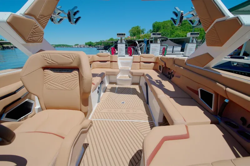 Slide: The Image of Luxurious interior of 2025 MasterCraft XStar 25 boat with tan seating and modern design. - 9