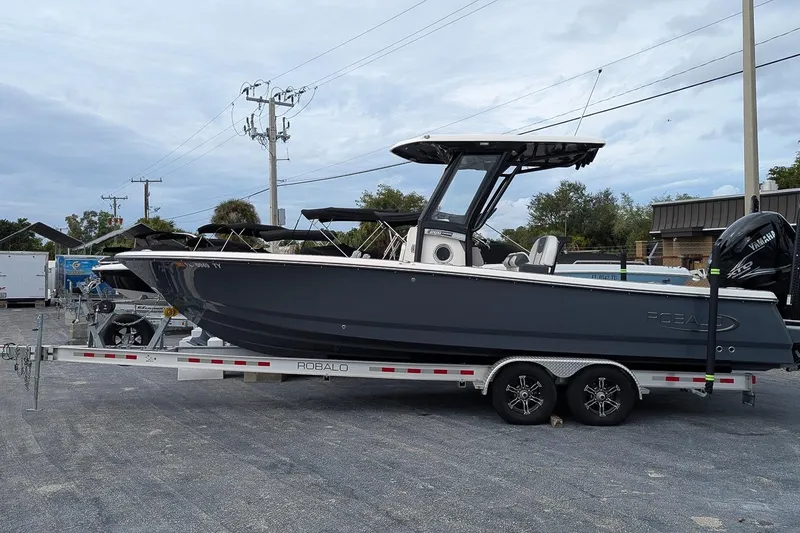 The Image of 2023 Robalo 266 Cayman boat on trailer, side view, outdoors. - 0