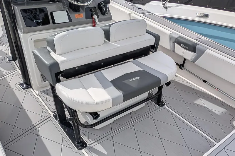 Slide: The Image of 2023 Robalo 266 Cayman boat interior with cushioned seating and modern design. - 11