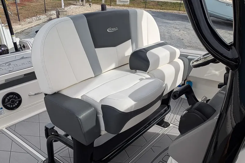 Slide: The Image of 2023 Robalo 266 Cayman boat seat, white and gray upholstery, modern design. - 12