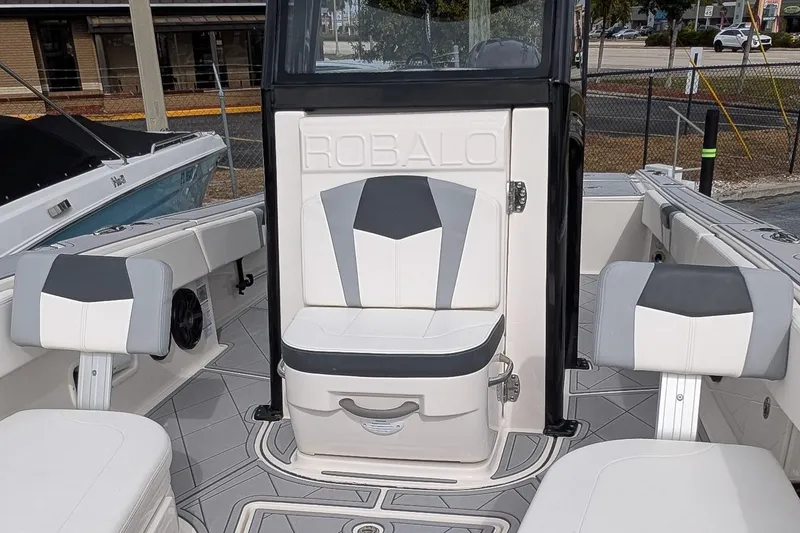 Slide: The Image of 2023 Robalo 266 Cayman boat interior with stylish seating and modern design. - 18