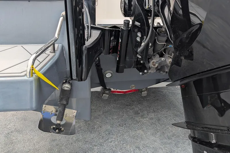 Slide: The Image of 2023 Robalo 266 Cayman boat engine and trim tab detail. - 5