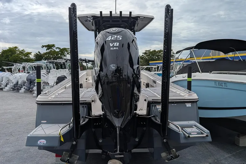 Slide: The Image of 2023 Robalo 266 Cayman boat with powerful V8 engine, displayed at a marina. - 6