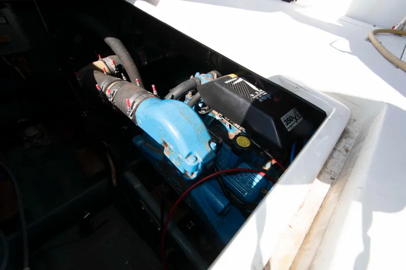 Slide: The Image of Engine compartment of a 1995 Carver 330 Mariner boat, showcasing mechanical components. - 10