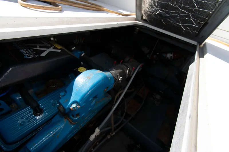 Slide: The Image of Engine compartment of a 1995 Carver 330 Mariner boat, showcasing mechanical components. - 9