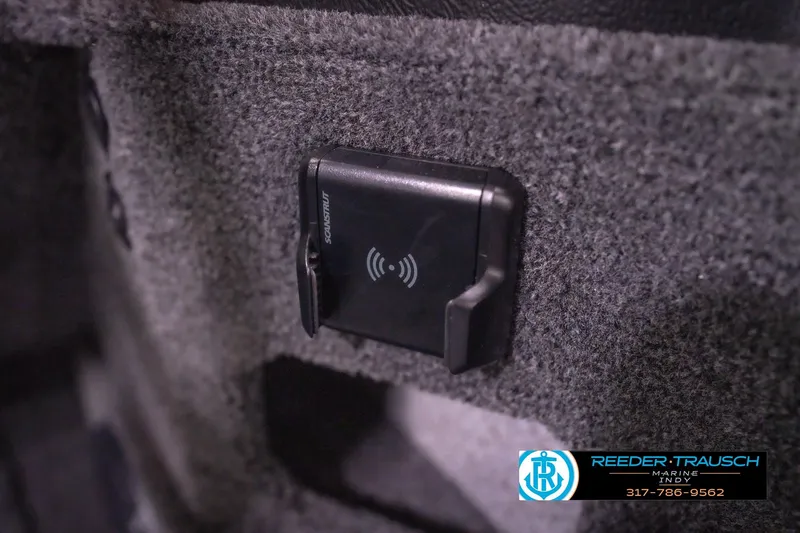 Slide: The Image of 2026 Lund 2075 Impact XS boat interior with wireless charging pad. - 39