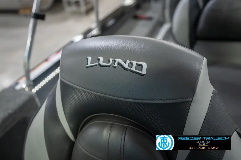 Slide: The Image of 2026 Lund 2075 Impact XS boat seat with logo, featuring sleek gray upholstery. - 42