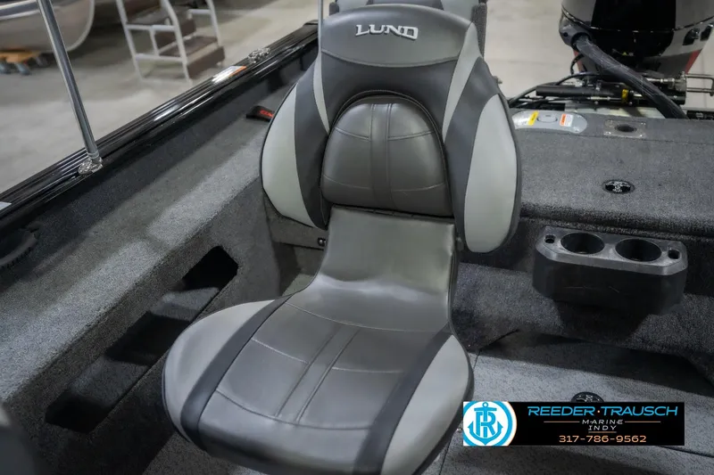 Slide: The Image of 2026 Lund 2075 Impact XS boat seat, gray and black, with cup holders. - 43