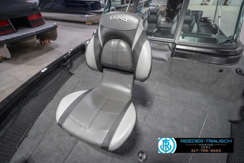 Slide: The Image of 2026 Lund 2075 Impact XS boat seat in a showroom setting. - 45