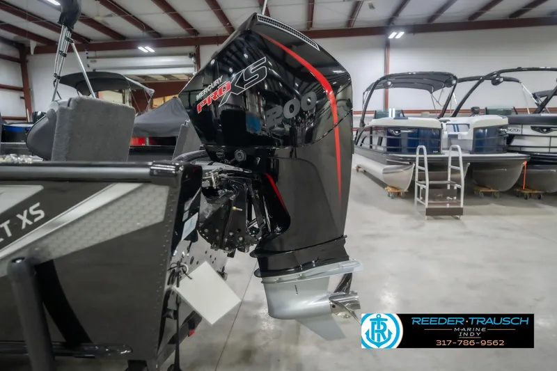 Slide: The Image of 2026 Lund 2075 Impact XS boat with Mercury Pro XS engine in showroom. - 49