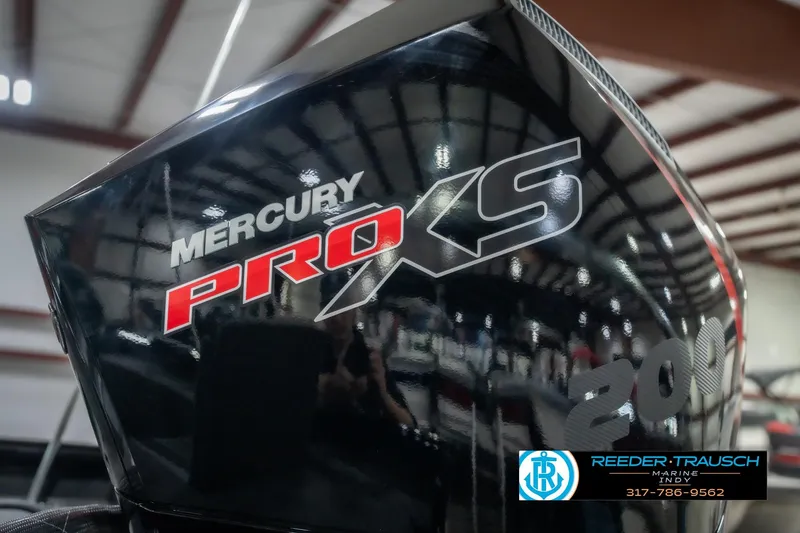 Slide: The Image of 2026 Lund 2075 Impact XS with Mercury Pro XS engine in showroom. - 50