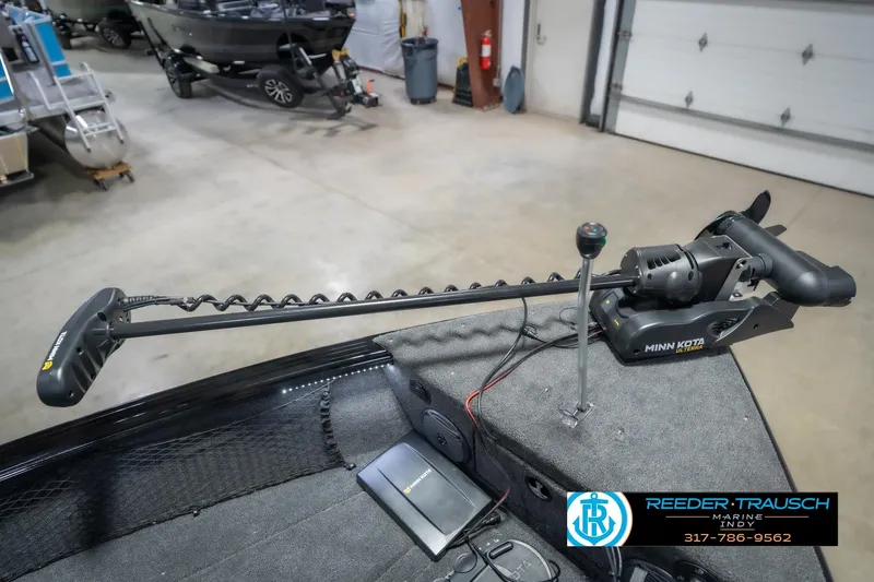 Slide: The Image of 2026 Lund 2075 Impact XS boat with Minn Kota trolling motor in showroom. - 54