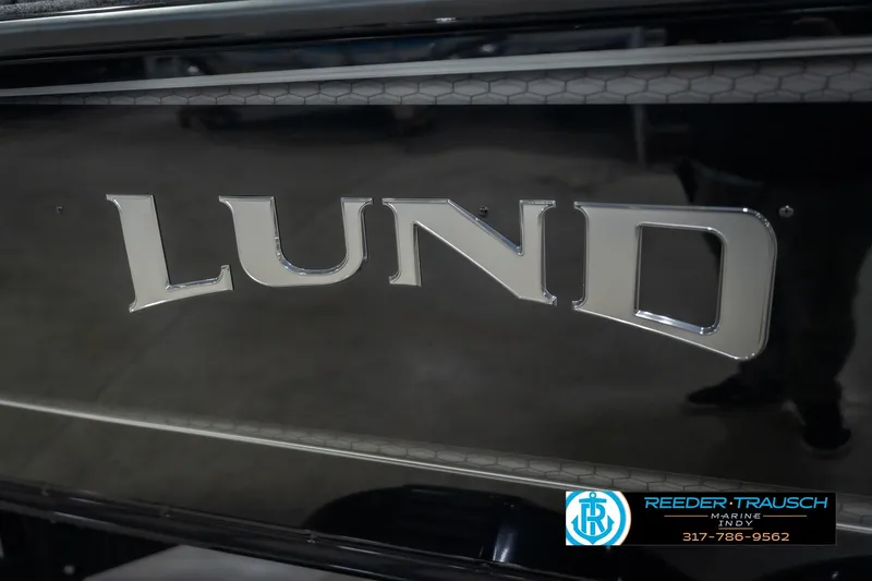Slide: The Image of 2026 Lund 2075 Impact XS boat logo with Reeder-Trausch Marine contact details. - 58