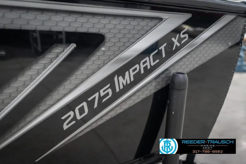 Slide: The Image of 2026 Lund 2075 Impact XS boat with sleek design and hexagonal pattern detailing. - 59
