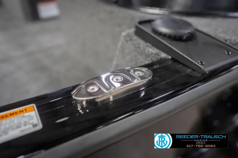 Slide: The Image of 2026 Lund 2075 Impact XS boat detail with Reeder-Trausch Marine logo. - 71