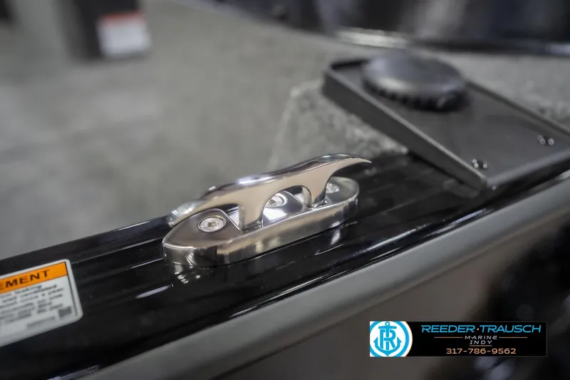 Slide: The Image of 2026 Lund 2075 Impact XS boat cleat detail, Reeder-Trausch Marine branding visible. - 72