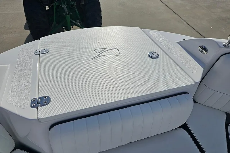 Slide: The Image of 2026 Stingray 211 DC boat deck with textured surface and logo. - 32