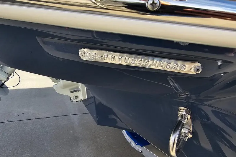 Slide: The Image of 2026 Stingray 211 DC boat hull identification number plate close-up. - 37